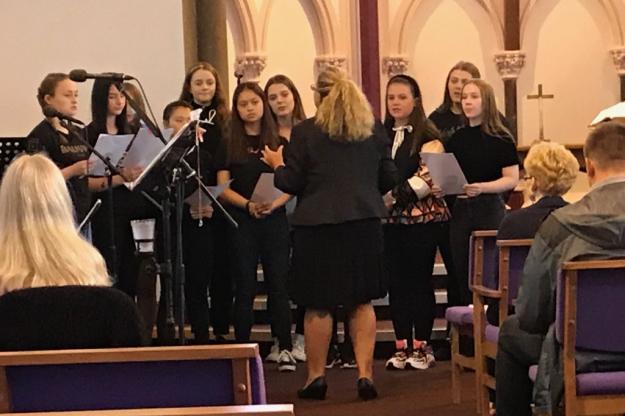 Students Perform at Marie Curie Service